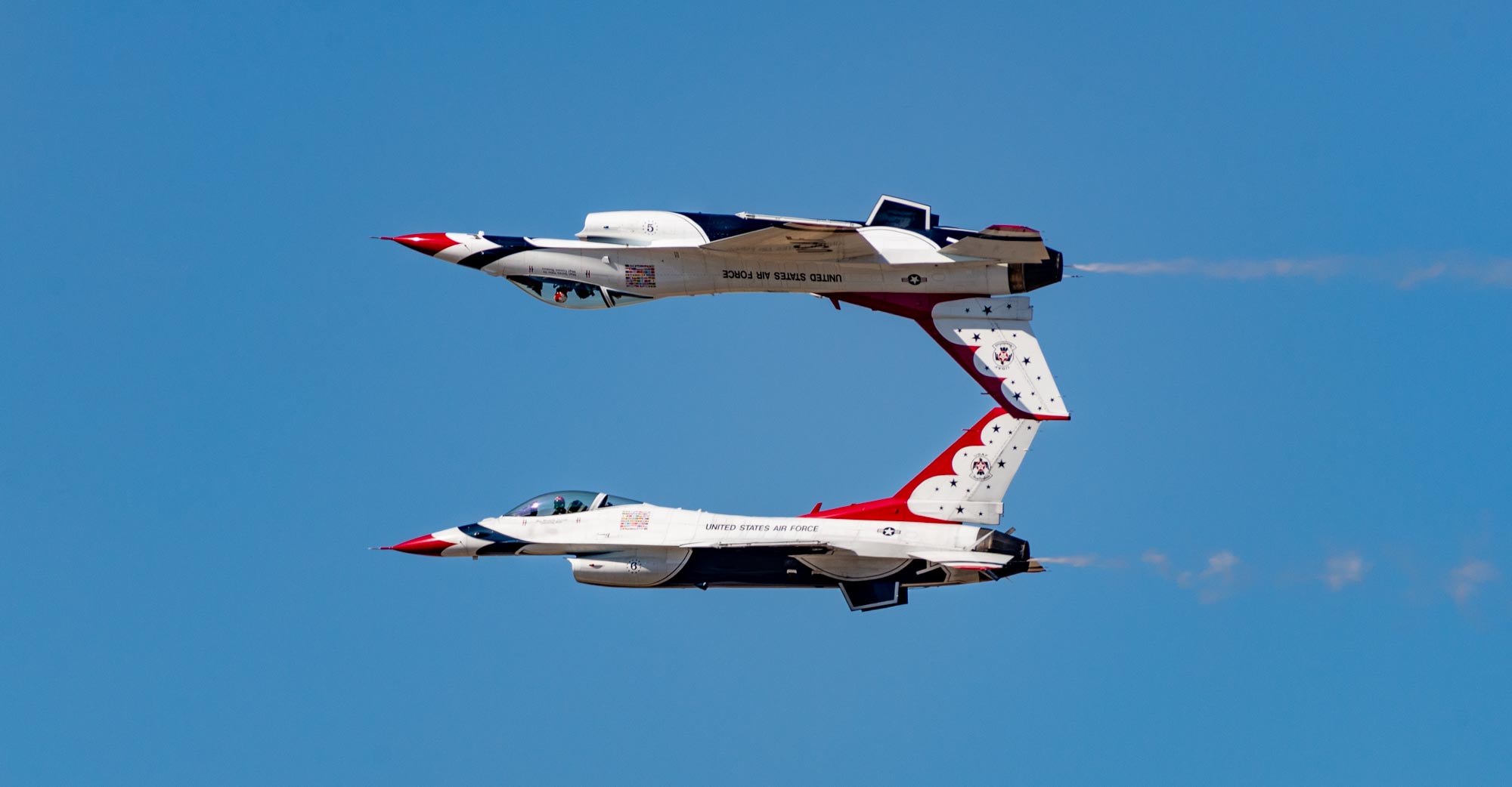 Two jets fly overhead in formation