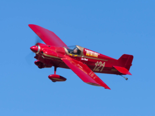 An airplane flies overhead.