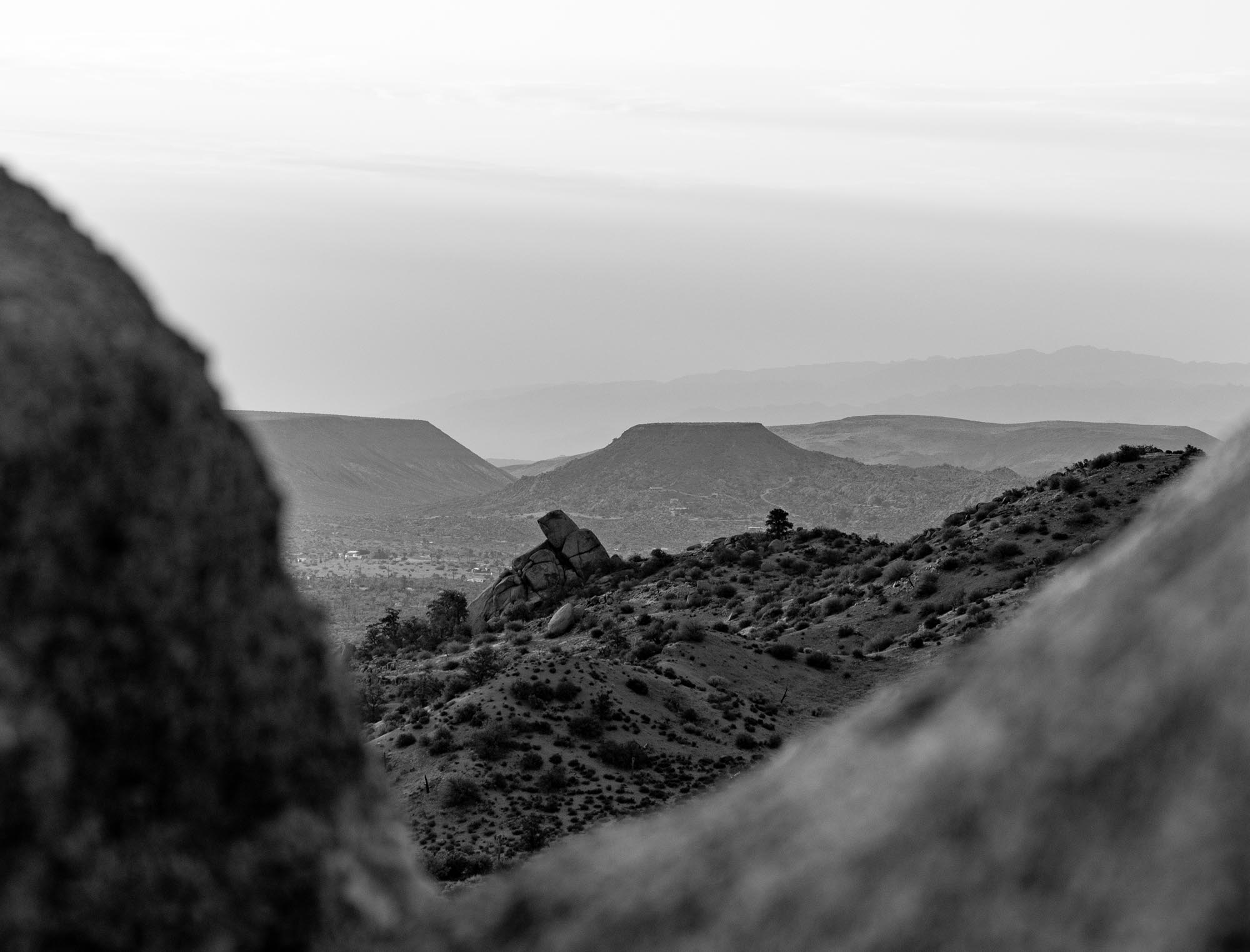 A black and white photo of some rocks and mountains.