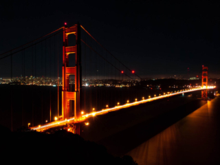 The Golden Gate Bridge at night with San Francisco in the background